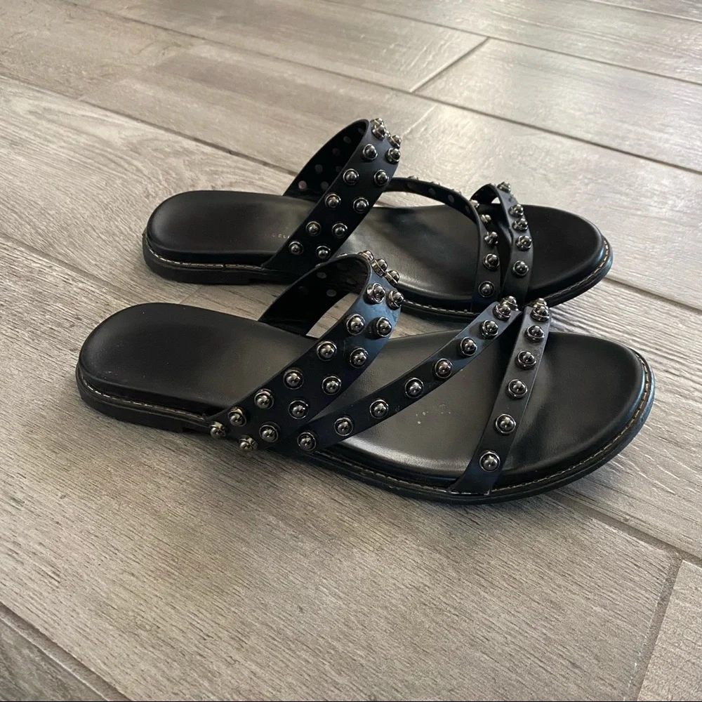Black leather sandals with spikes